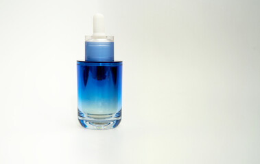 cosmetic dropper cap bottle on white