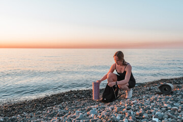 sport fit outdoor sea.girl goes sports,fitness,yoga seashore.Meditation, relaxation, mental health.Active lifestyle, self-care, health.Wellness.Fit nature.myofascial release workouts tracking fitness