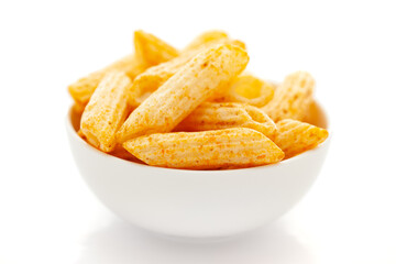 Close up of Cheese Puff Snacks cream color, Popular Ready to eat crunchy and puffed snacks cheesy salty pale-yellow color