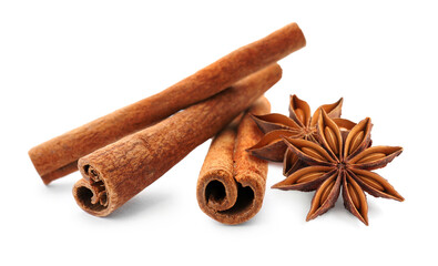 Aromatic cinnamon sticks and anise stars with seeds on white background