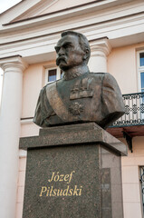 Bust of Jozef Pilsudski in front of the Town Hall. Konin, Greater Poland Voivodeship, Poland. - obrazy, fototapety, plakaty