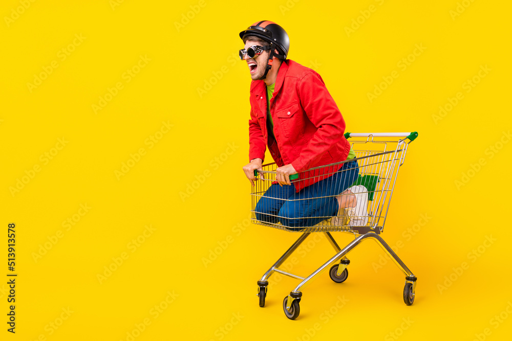 Poster Full length body size view of attractive cheery guy inside cart having fun copy space isolated on bright yellow color background
