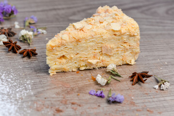 Napoleon cake dessert on a wooden background
