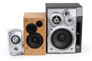 Three different home loudspeaker systems on a white background