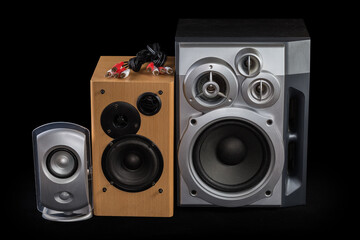 Three different home loudspeaker systems and audio cables