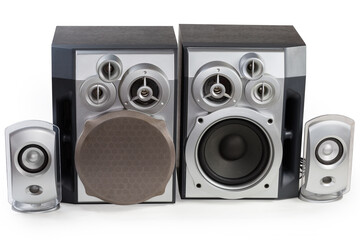 Two pairs of different home loudspeaker systems on white background