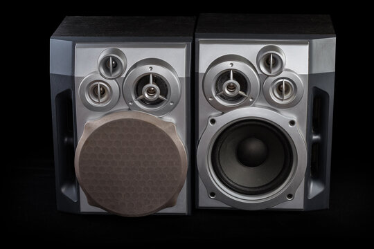 Pair of home three-way loudspeaker systems on black background
