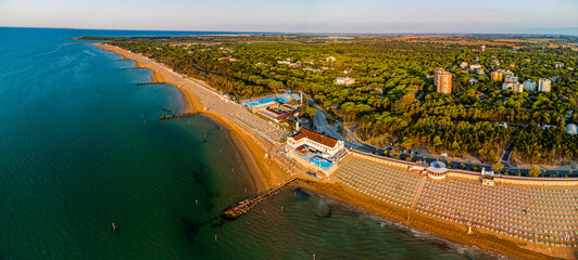 Sunrise in Lignano Sabbiadoro seen from above. From the sea to the lagoon, the city of holidays