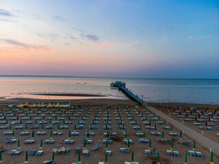 Obraz premium Sunrise in Lignano Sabbiadoro seen from above. From the sea to the lagoon, the city of holidays