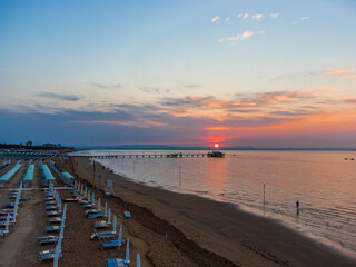 Obraz premium Sunrise in Lignano Sabbiadoro seen from above. From the sea to the lagoon, the city of holidays