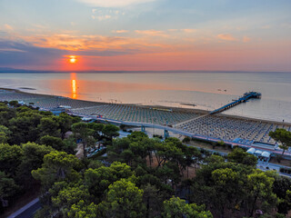 Sunrise in Lignano Sabbiadoro seen from above. From the sea to the lagoon, the city of holidays