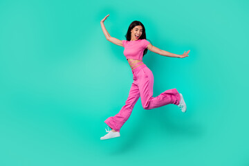 Fototapeta na wymiar Full size photo of cheerful lady jumping high enjoy discounts wear trend stylish outfit isolated cyan color background