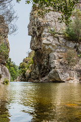 Water motion of river beach with geomorphological formation rocks at the Ceira doors, Serpins PORTUGAL