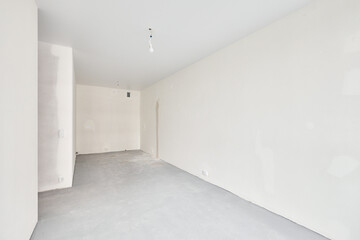 Interior of new apartment without finishing in gray tones
