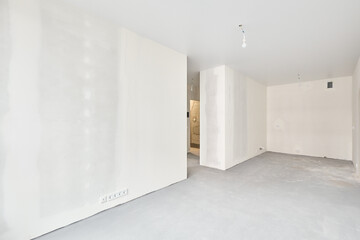 Interior of new apartment without finishing in gray tones