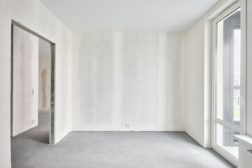 Interior of new apartment without finishing in gray tones