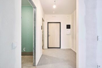 Interior of new apartment without finishing in gray tones