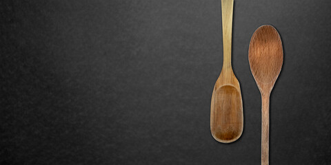Topview of Cooking Wooden Spoons on Dark Background