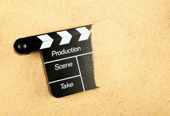 image of clapper board sand background