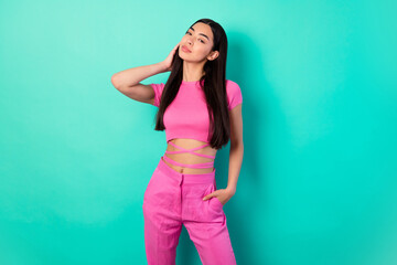 Photo of adorable girl flirting with man on walk wear crop top with crossed striped on belly isolated on teal color background