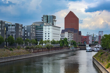 Inner harbor of Duisburg, Germany with the State archive of North Rhine-Westphalia, the monumental...