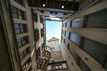 Duisburg City Hall in the inner courtyard, view up to the tower with clock, blue sky