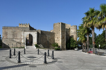 View of the square in front of the medieval castle of Miglionico, a historic town in the province...