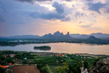 Phu Sub Lek is hidden gem of Lopburi, Thailand to see view of Khao Jeen Lae with unseen sunset sky over the water from lake.