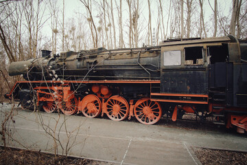 Steam locomotive parked at a terminal station. Historical railroad from 1940