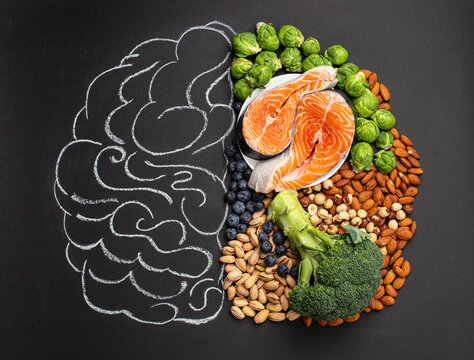 Chalk hand drawn brain with assorted food, food for brain health and good memory