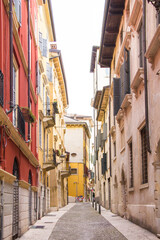 Fototapeta na wymiar Cozy narrow street in the center of Verona.
