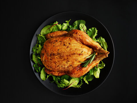 Roast chicken on mixed herb salad
