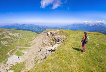 Obraz premium Monte Gorzano, Italy - The highest peak in the mountain range named Monti della Laga, Lazio and Abruzzo region, with Cento Fonti waterfalls and hikers who practice trekking in altitude.