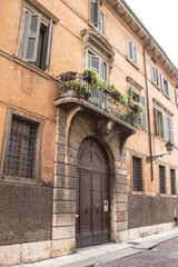 Fototapeta na wymiar Cozy narrow street in the center of Verona.