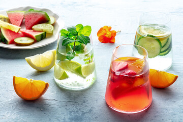 Summer cocktails. Cold drinks with fresh fruits. Healthy mocktails. Glasses of lemonade with ice...