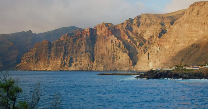 Los Gigantes cliffs. Sunset on Tenerife, Canary Islands, Spain. Volcanic rocky seaside resort in the Canary Islands.