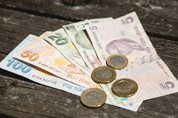 Lira money of the Republic of Turkey on a wooden table