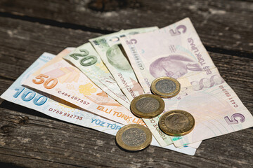 Lira money of the Republic of Turkey on a wooden table