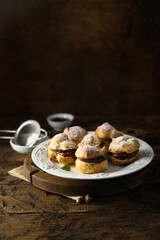 Homemade profiteroles with chocolate paste