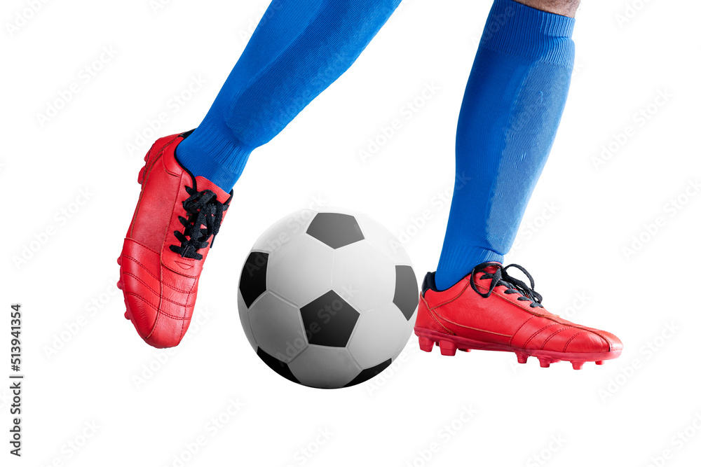 Wall mural Football player man in a blue jersey kicking the ball