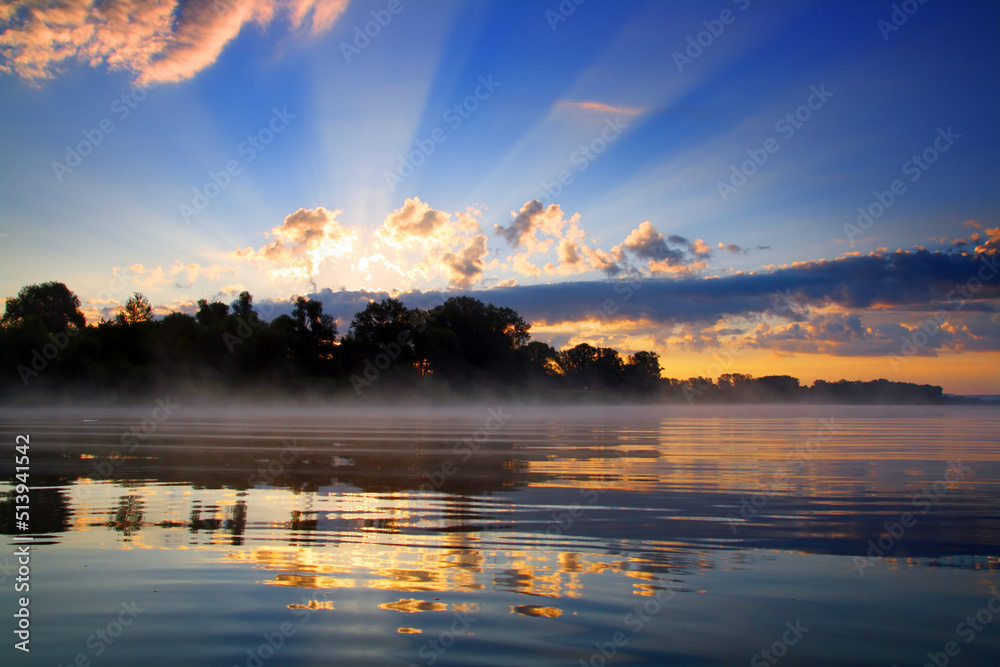 Wall mural sunrise and reflection in river
