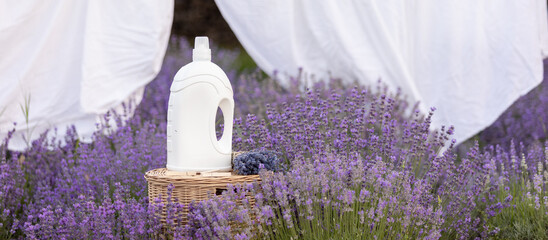 Fabric softener with lavender scent. Fragrance in a field with purple flowers.