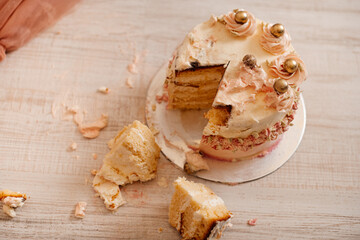 Smashed cake on the floor for first birthday. Messy pieces