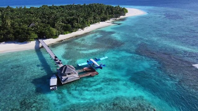 Seaplane moored in the middle of the Indian Ocean, Vakkaru, Maldives. Seaplane transporting passengers to tropical places such as Maldivian islands, Seychelles, Australia, Bora Bora in French