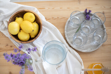 Making a refreshing summer drink. Preparing lemonade in the kitchen. Healthy food concept
