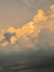 Fototapeta na wymiar beautiful big lush yellow gray clouds. aesthetic photo