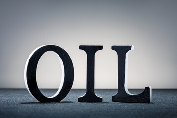 word oil on the grey background. concept oil industry.