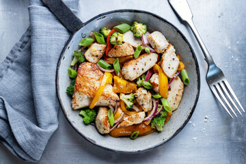 Chicken with vegetables in bowl
