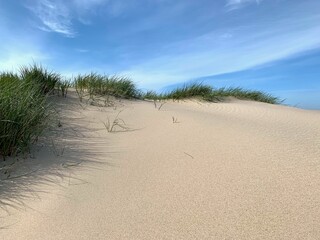 beautiful untouched sand dune against a blue sky with a few veil clouds, holiday, vacation, tourism, Denmark
