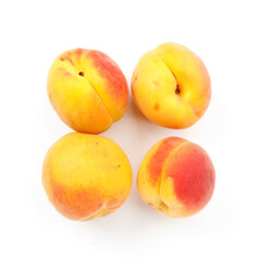 Juicy vitamin apricots on a white background, sweet fruits.